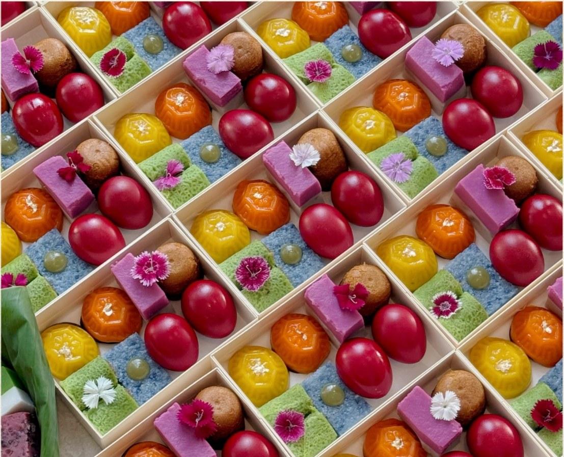 Phoenix Gift Set with angku kuih, colourful Nyonya kuih and traditional red eggs in a compact butterfly bento box.