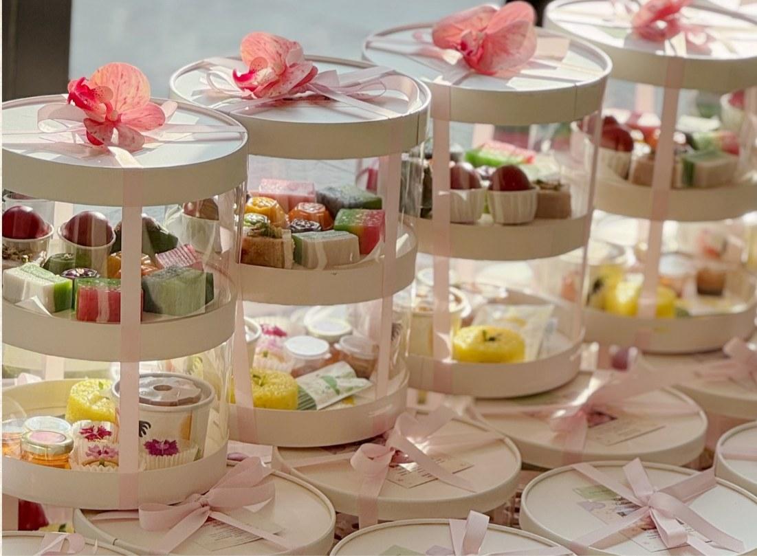 Luna's Double Layer Gift Set with four colour angku kuih, Nyonya kuih, tarts, curry chicken, nasi pulut kunyit, butter cake, honey and red eggs.